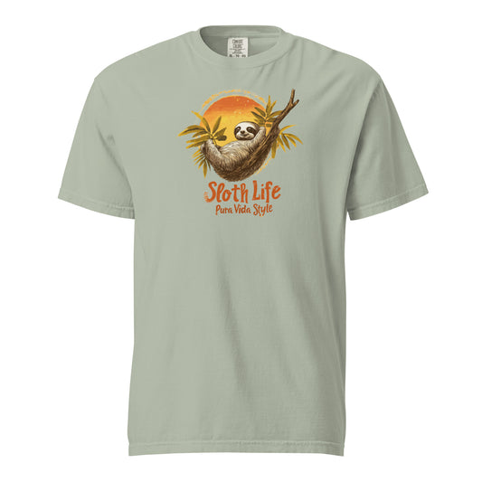 Illustration of a sloth hanging from a branch with tropical leaves and the text "Sloth Life Pura Vida Style" on a brown t-shirt design.