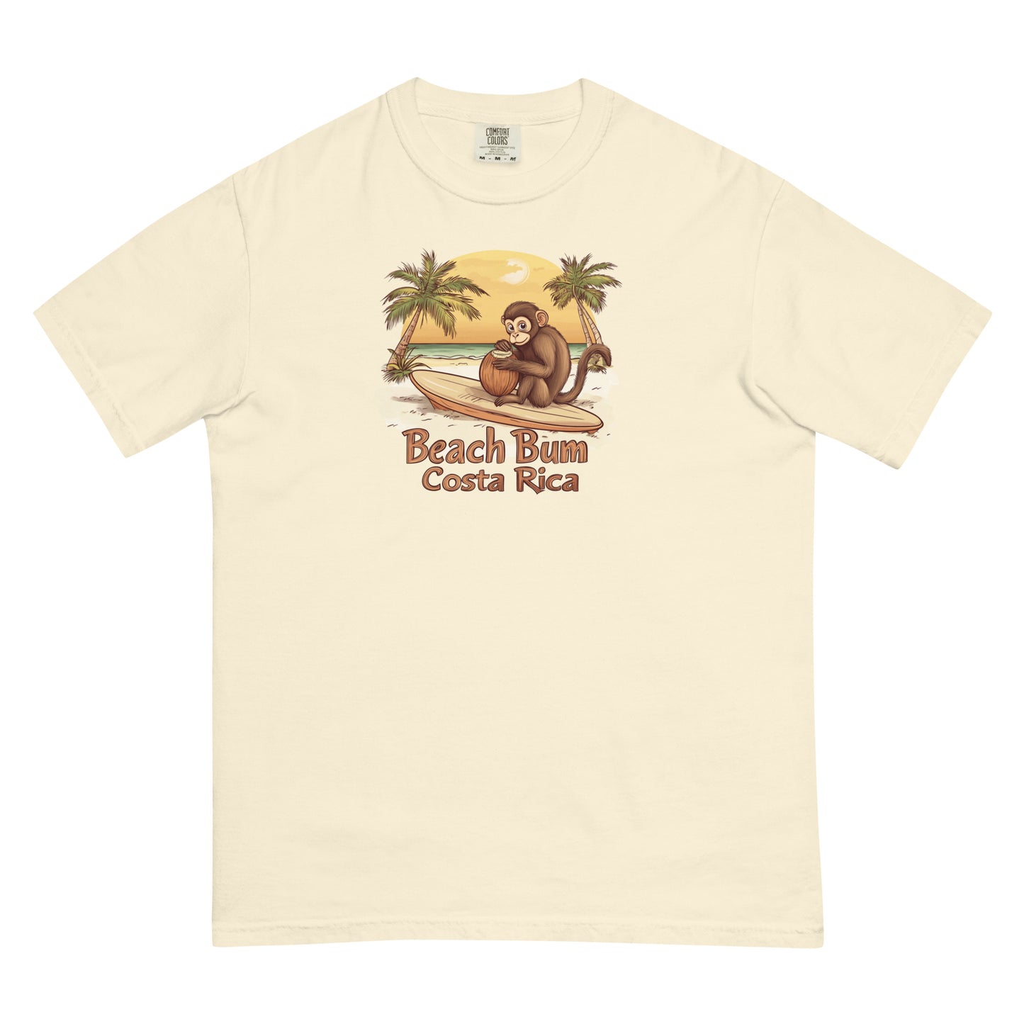 Yellow T Shirt Cartoon capuchin monkey sitting on a surfboard, holding a coconut, with palm trees and a sunset on a Costa Rica beach, 'Beach Bum Costa Rica'