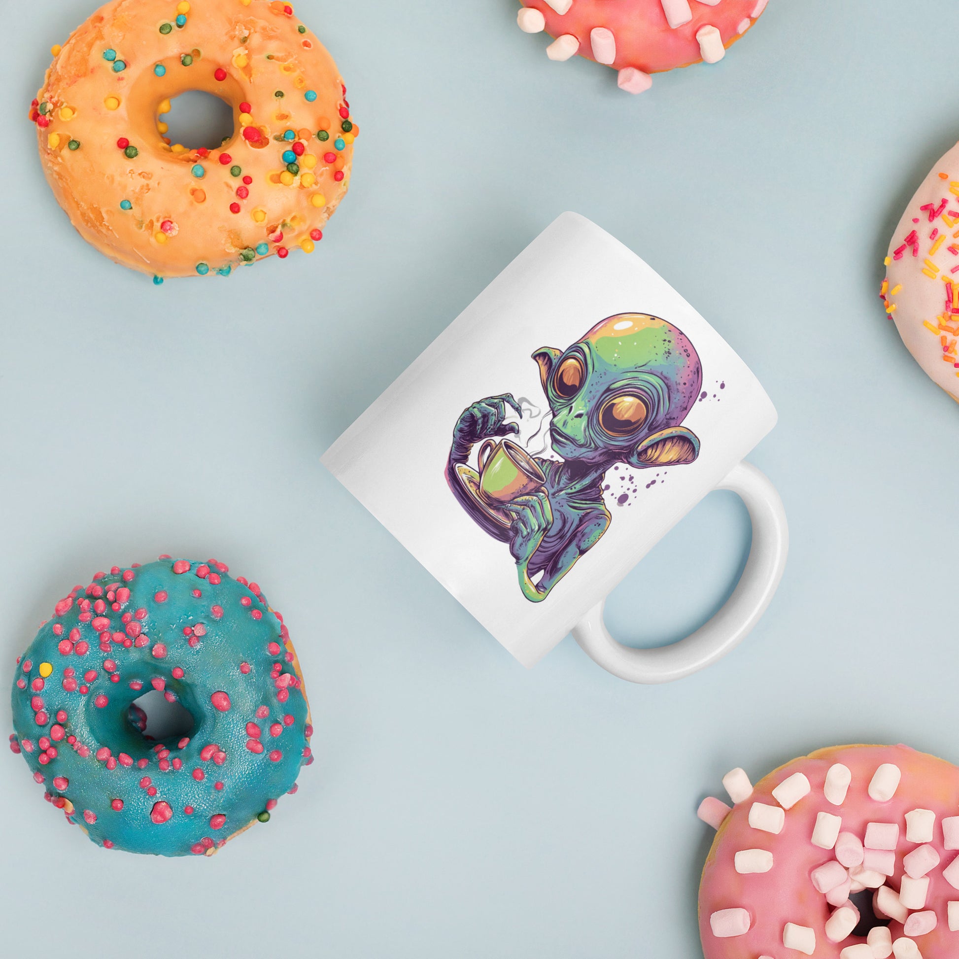 Quirky alien drinking a steaming cup of coffee, colorful sci-fi design on a white background, perfect for coffee lovers and sci-fi fans.